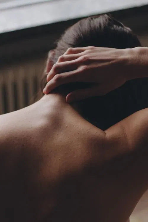 woman neck profile warm light" or "woman throat side view calm natural