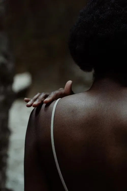 woman back shoulders warm light" or "woman upper back calm natural
