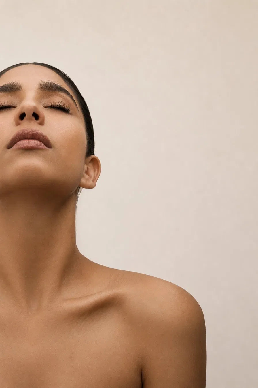 woman hand on chest breathing calm" or "woman stillness breath quiet light